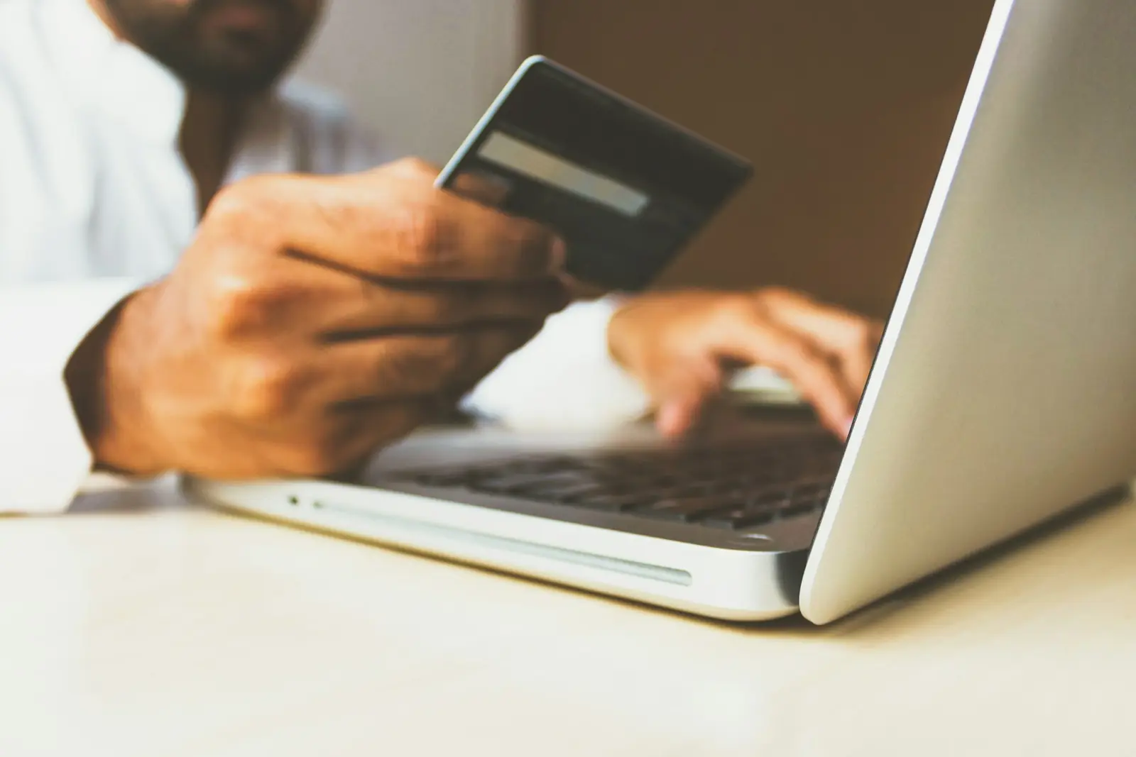 Customer completing a secure online payment on a laptop