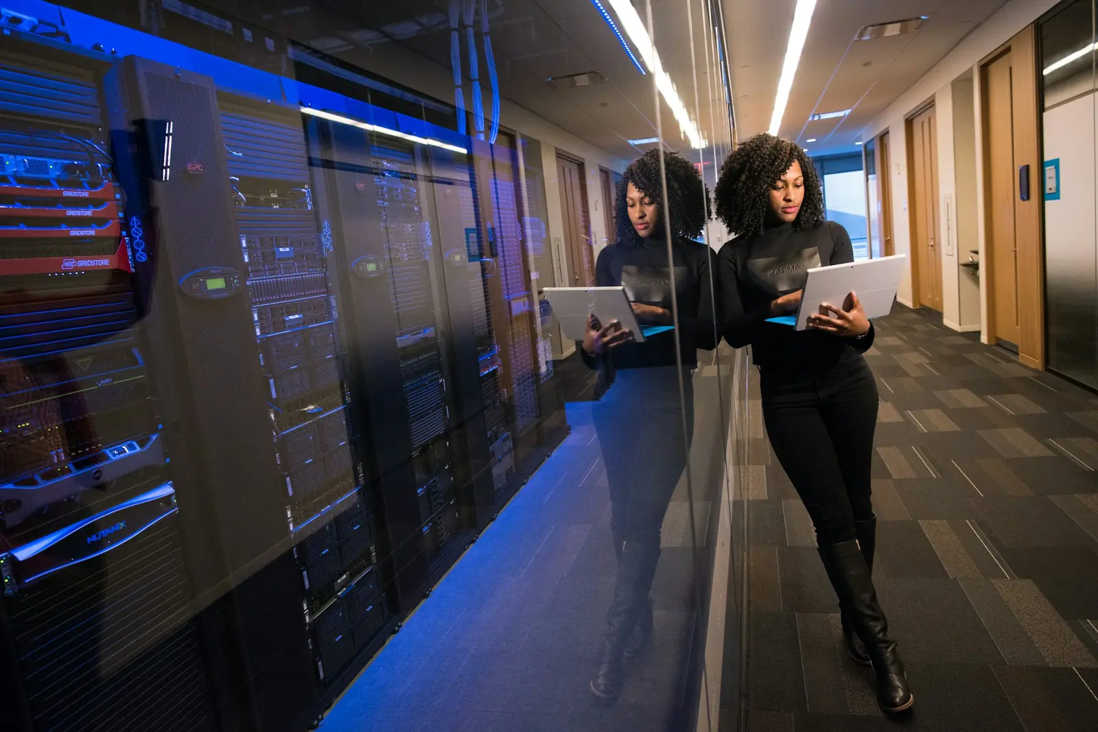 Engineers reviewing enterprise servers between data centre racks