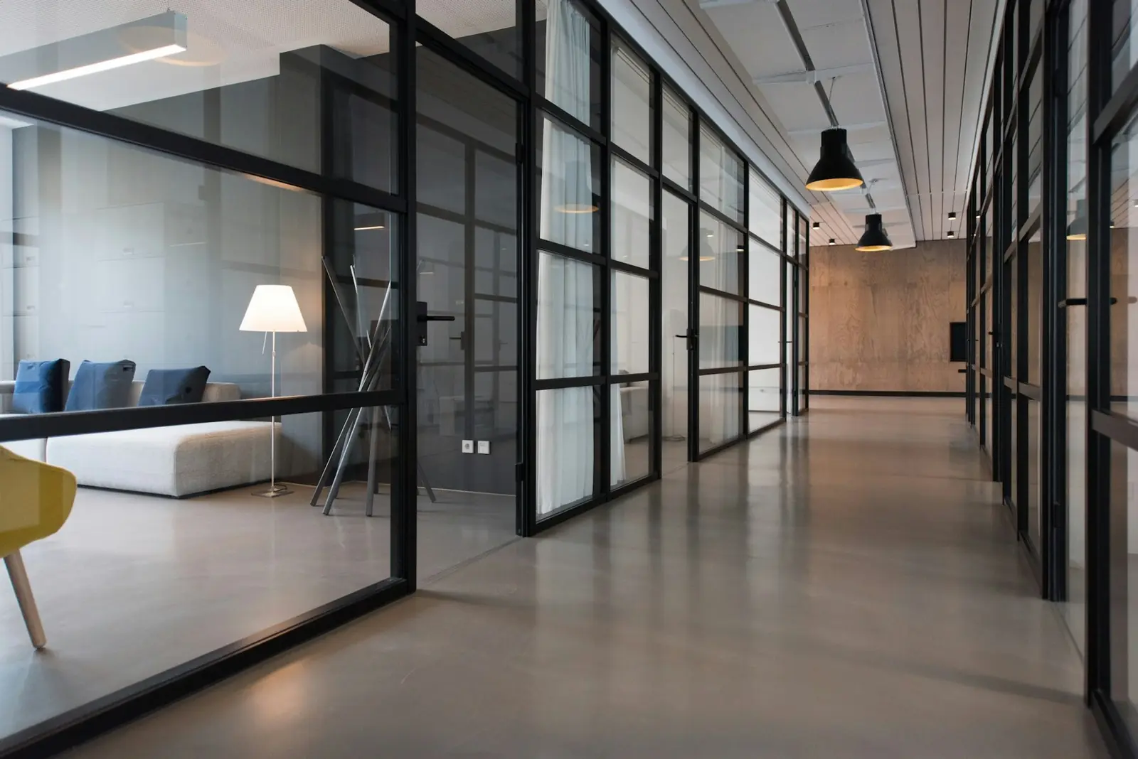 Modern corporate office interior with glass partitions