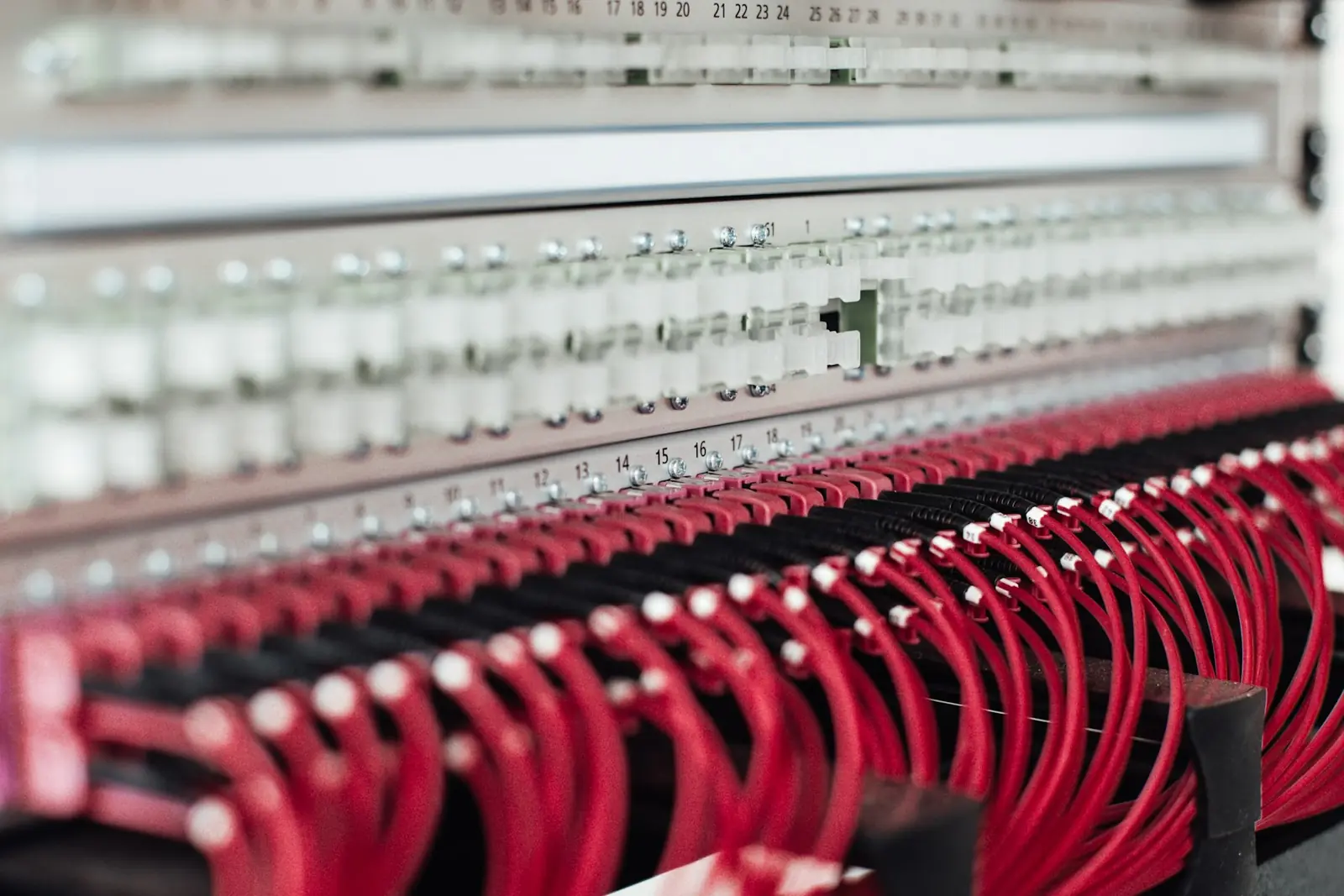 Structured cabling terminated into a patch panel with colour-coded leads