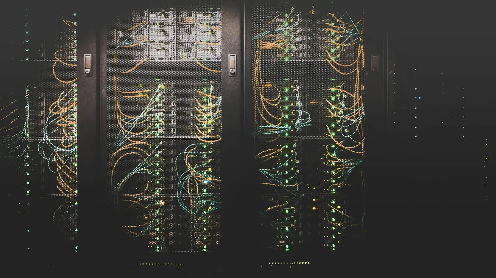 Enterprise network cabling running through equipment racks